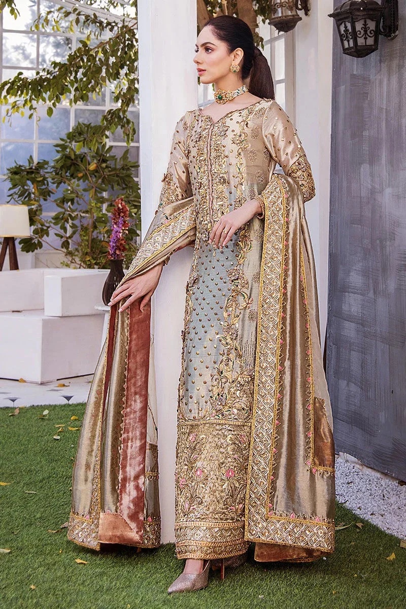Noor- e- Samar pakistani fashion outfit in gold, green tones.